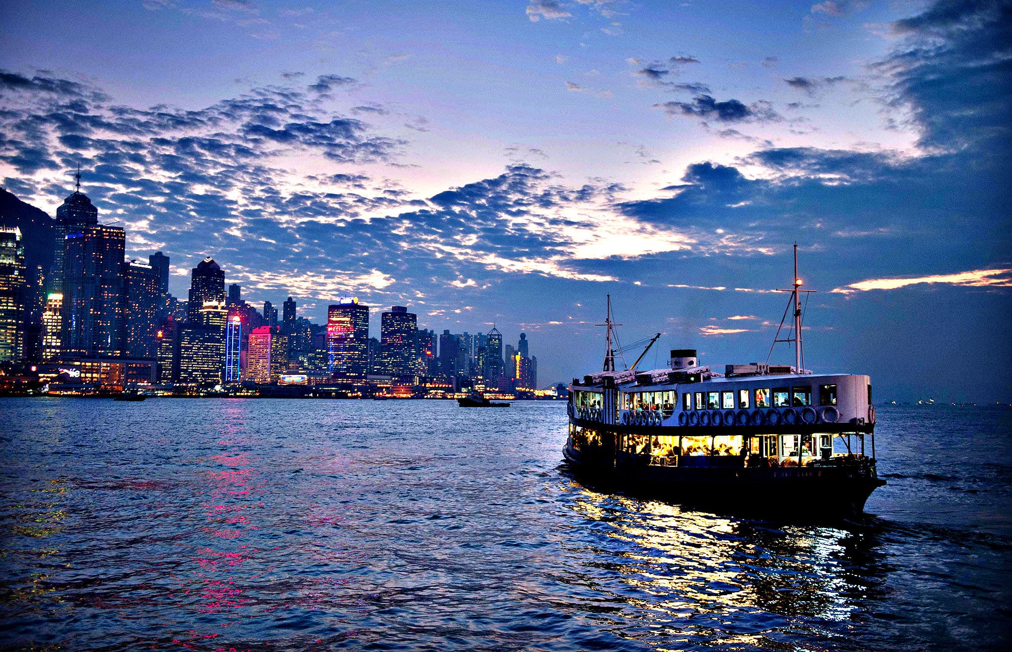 Star Ferry crossing Victoria Harbour during the day